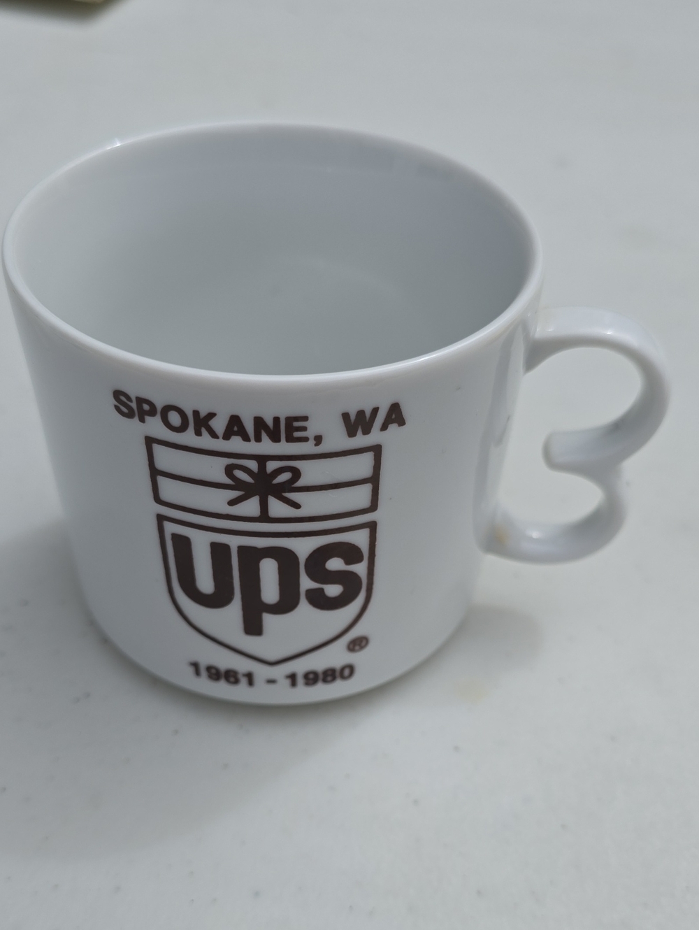 Source Unknown White Mug with Brown UPS Spokane WA Logo
